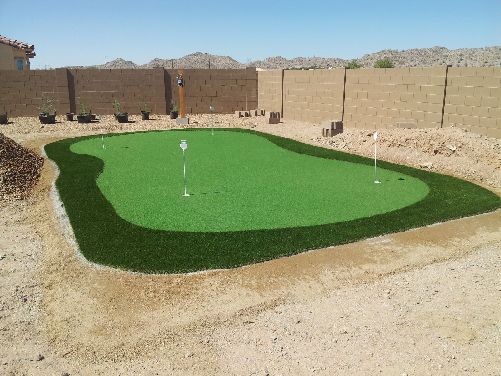Should Fake Grass Shed? Tempe Putting Green Installation